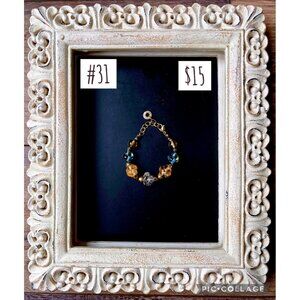 Swirl Glass Bead Blue, Amber Goldtone with clasp marked Murina Antica